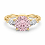 My Store 4 18K solid gold trilogy ring featuring a central fancy pink pear-cut diamond with two side pear diamonds.