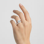 My Store 4 round tulip solitaire engagement ring and eternity band set in 18K yellow gold worn on a woman's hand.