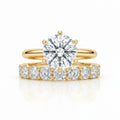 My Store 4 round tulip solitaire engagement ring and eternity band set in 18K yellow gold with brilliant diamonds.
