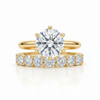 My Store 4 round tulip solitaire engagement ring and eternity band set in 18K yellow gold with brilliant diamonds.