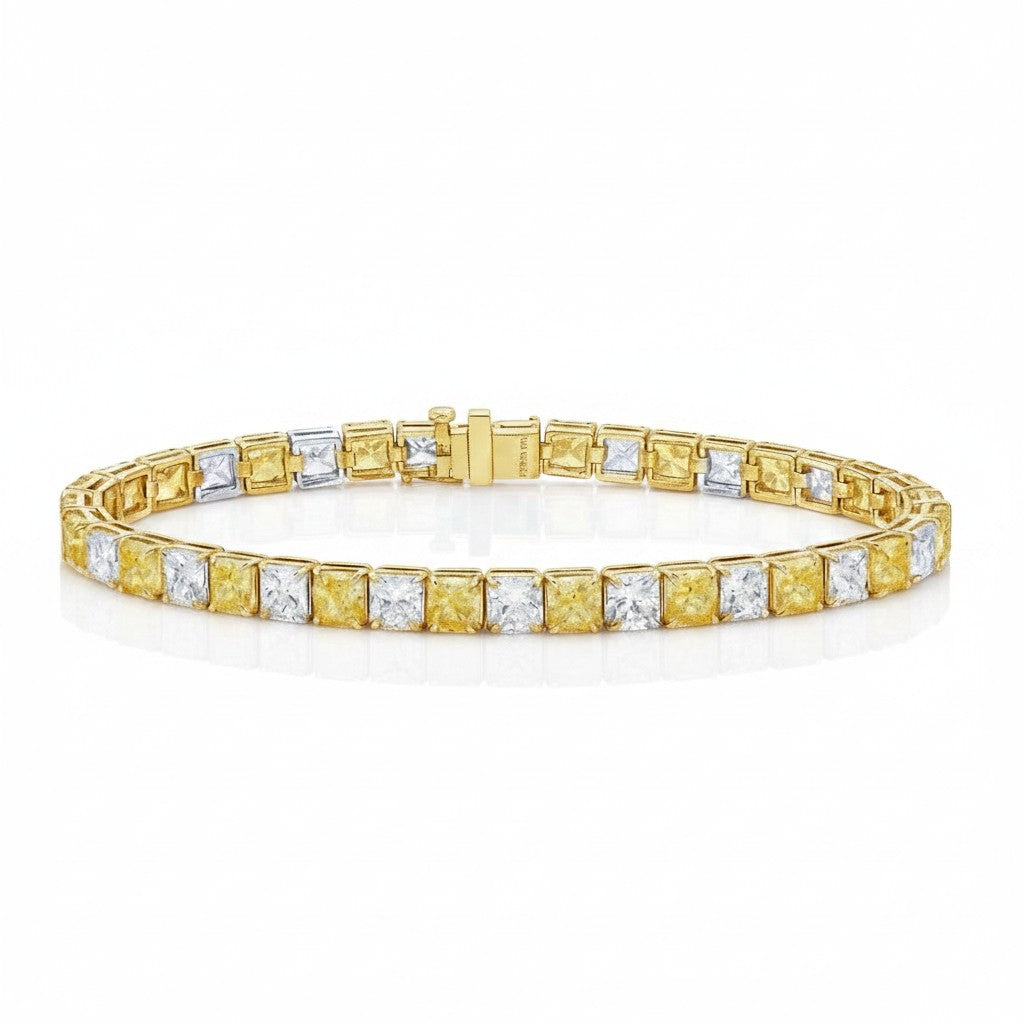 My Store 4 two-tone tennis bracelet featuring alternating yellow and white cushion-cut diamonds in gold box settings.