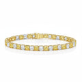 My Store 4 two-tone tennis bracelet featuring alternating yellow and white cushion-cut diamonds in gold box settings.