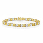 My Store 4 two-tone tennis bracelet featuring alternating yellow and white cushion-cut diamonds in gold box settings.