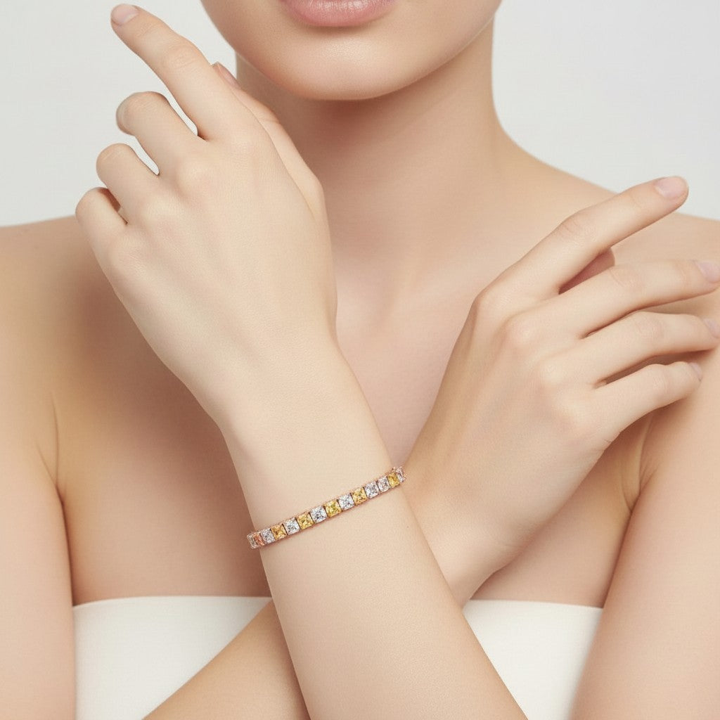 My Store 4 two-tone tennis bracelet featuring alternating fancy yellow and white cushion-cut diamonds in gold settings.