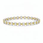 My Store 4 two-tone tennis bracelet featuring alternating fancy yellow cushion-cut and white oval-cut diamonds in gold.