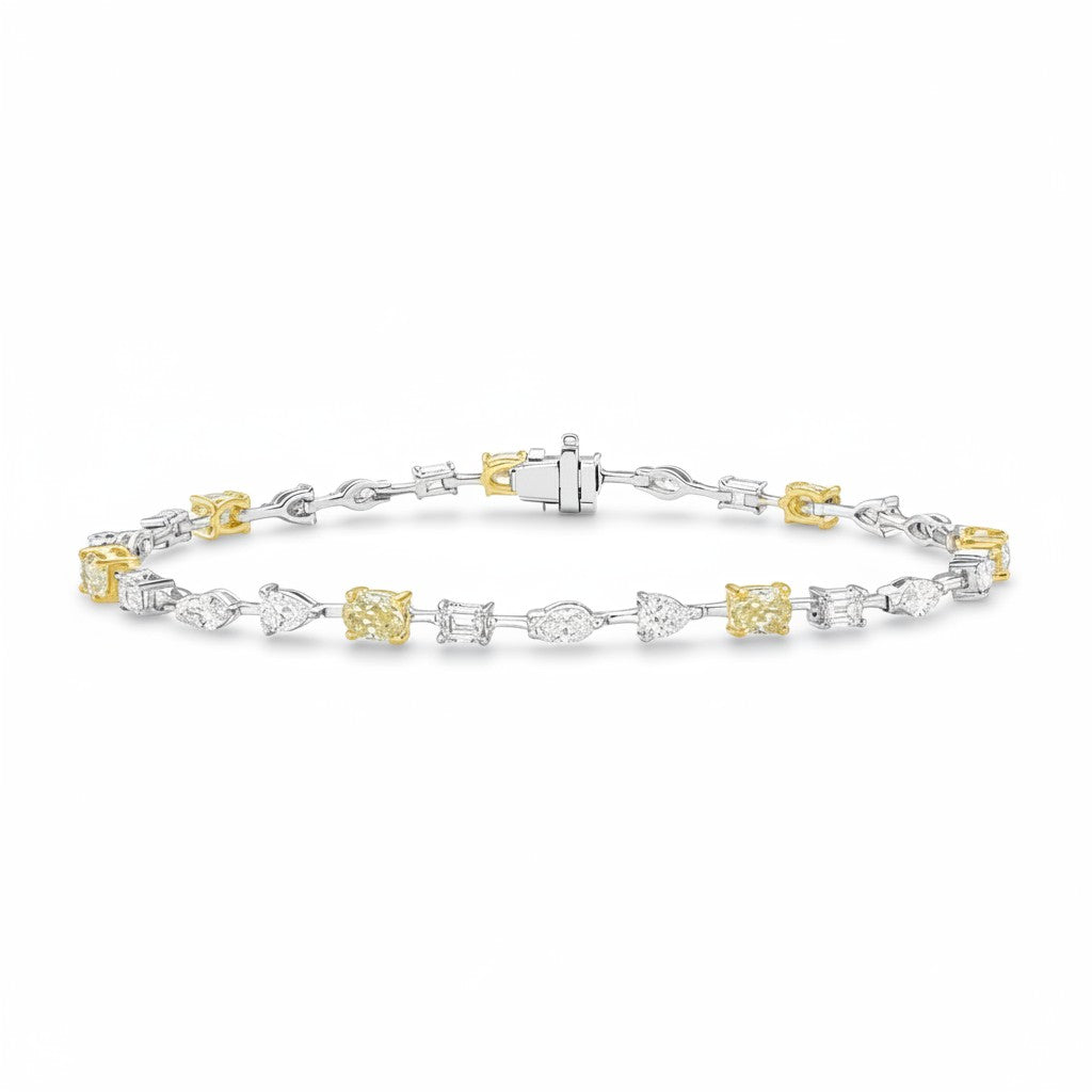 My Store 4 two-tone gold tennis bracelet featuring fancy yellow oval diamonds alternating with multi-shape white diamonds.