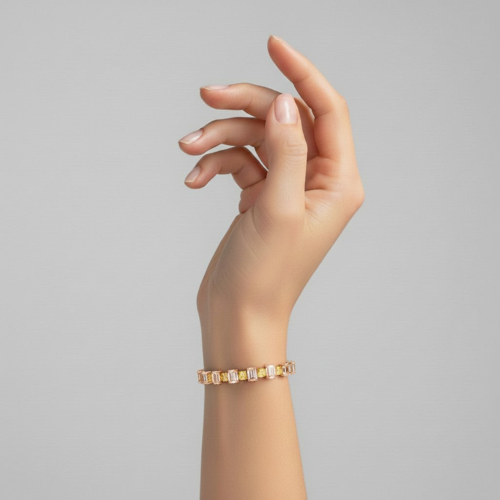 My Store 4 two-tone tennis bracelet featuring alternating fancy yellow cushion and white oval diamonds on a wrist.