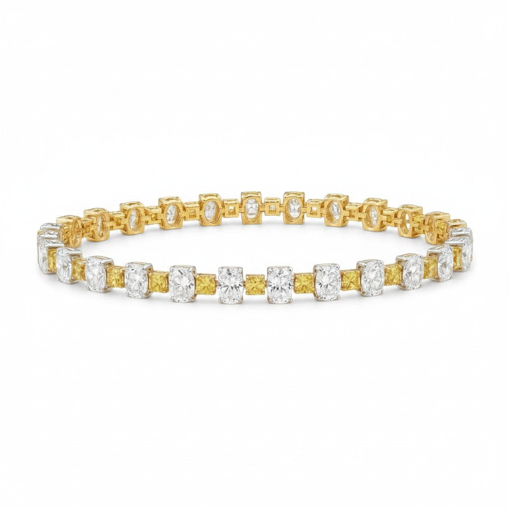 My Store 4 two-tone tennis bracelet with alternating fancy yellow cushion and white oval diamonds in gold settings.