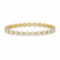 My Store 4 two-tone tennis bracelet with alternating fancy yellow cushion and white oval diamonds in gold settings.