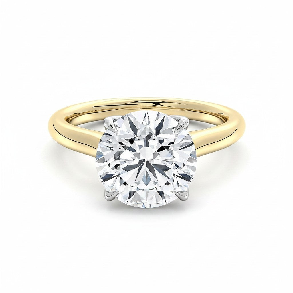 My Store 4 two-tone gold engagement ring with a round brilliant-cut solitaire diamond on a high-polish yellow band.