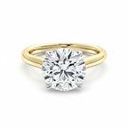 My Store 4 two-tone gold engagement ring with a round brilliant-cut solitaire diamond on a high-polish yellow band.