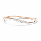 My Store 4 wave-contoured rose gold bangle featuring a graduated row of sparkling round brilliant diamonds.