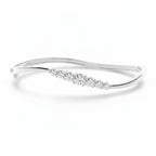 My Store 4 wave-contoured white gold bangle bracelet featuring a graduated row of sparkling round brilliant diamonds.