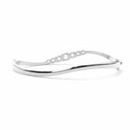 My Store 4 wave-contoured hinged bangle in white gold with a graduated row of round brilliant diamonds.