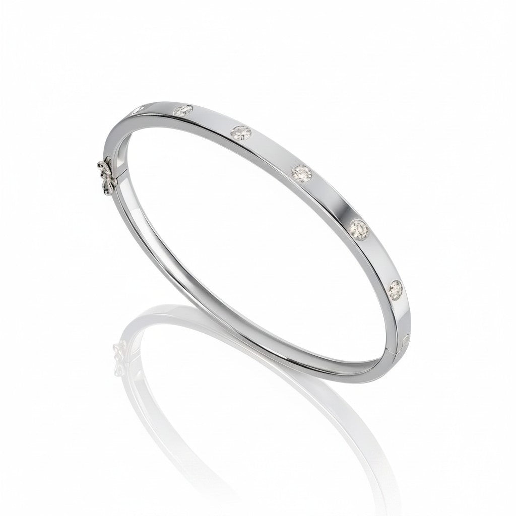 My Store 4 white gold bangle bracelet featuring flush-set round diamonds in a sleek, snag-free design.
