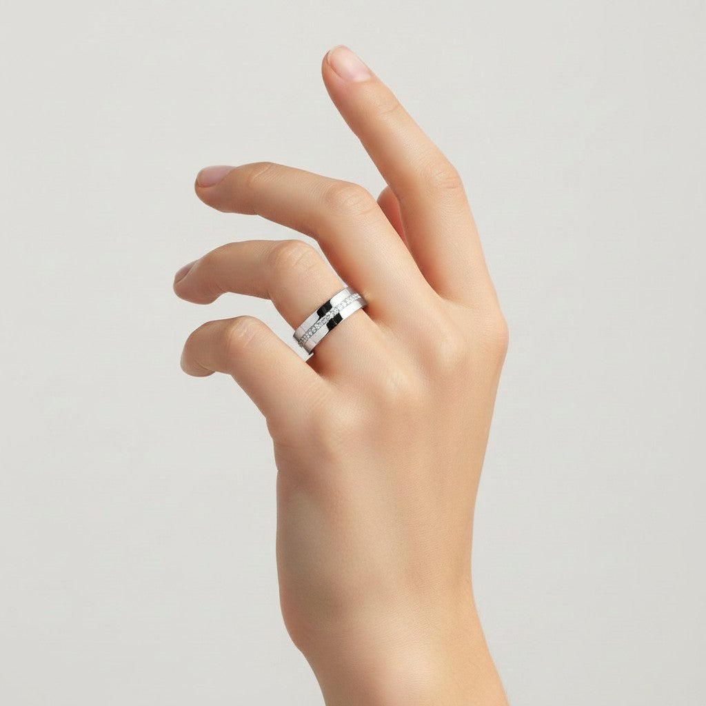 My Store 4 flat band wedding ring in white gold with an offset row of micro-pavé diamonds worn on a finger