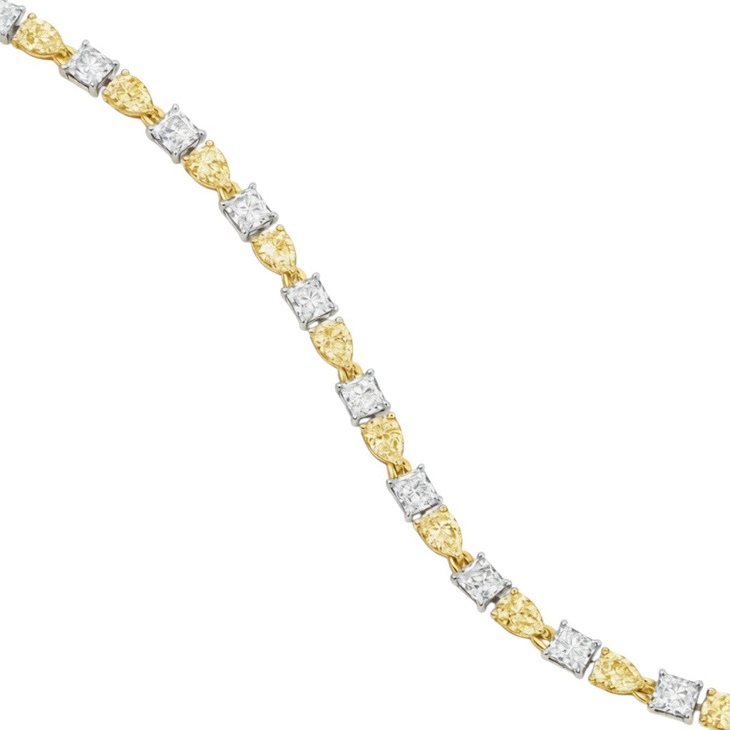 My Store 4 two-tone tennis bracelet featuring fancy yellow cushion-cut and white pear-cut diamonds in gold settings.