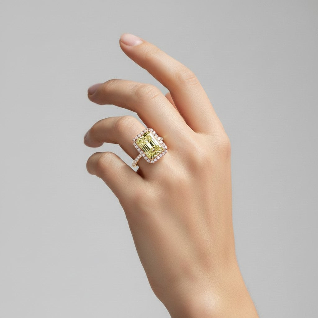 My Store 4 radiant-cut fancy yellow diamond halo ring in 18K solid gold worn on a woman's finger