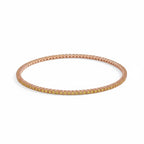 My Store 4 tennis bracelet featuring a continuous row of round-cut fancy yellow diamonds set in rose gold four-prong baskets