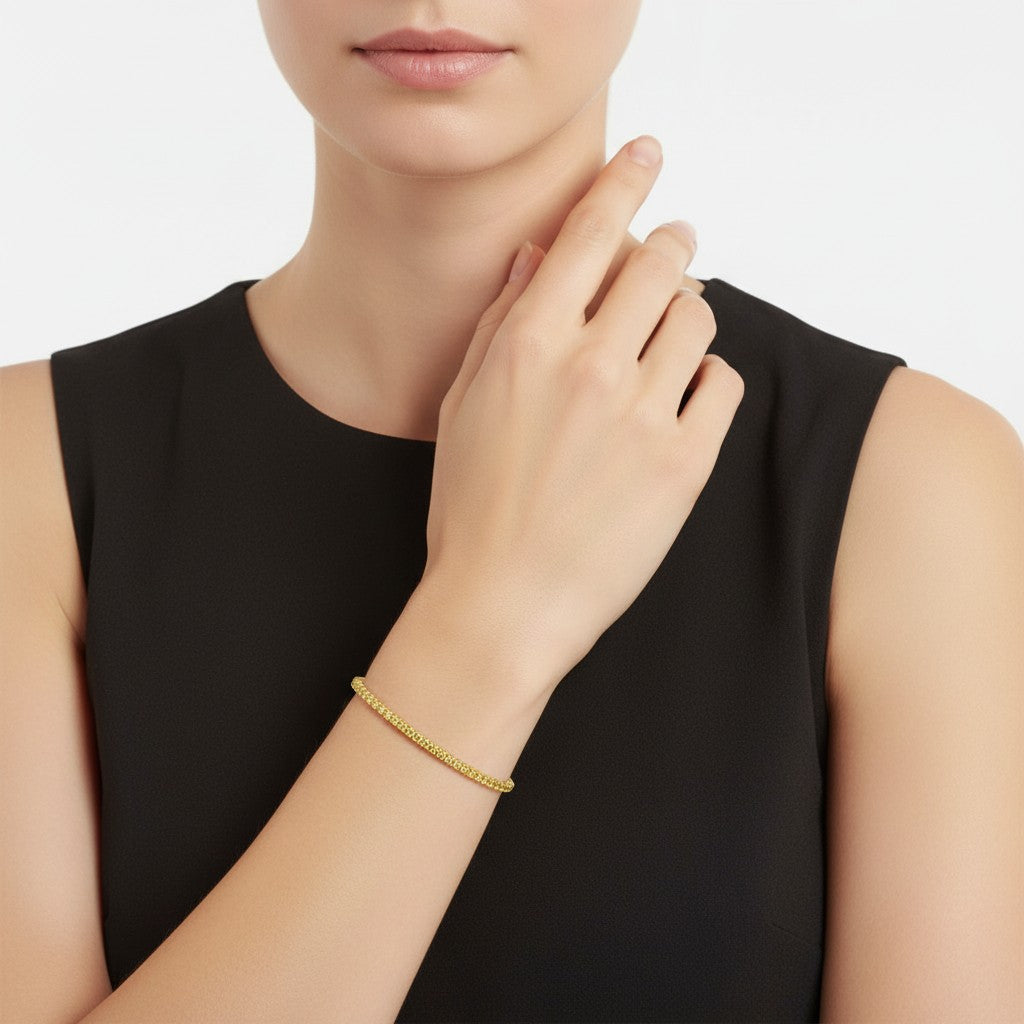 My Store 4 fancy yellow round cut diamond tennis bracelet in solid yellow gold worn on a woman's wrist