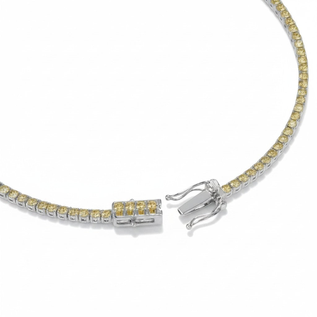 My Store 4 tennis bracelet featuring a row of fancy yellow round-cut diamonds in a white gold four-prong setting.