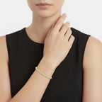 My Store 4 tennis bracelet featuring a continuous row of fancy yellow round-cut diamonds in a four-prong gold setting.