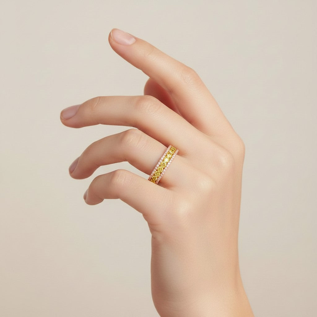 My Store 4 18K solid yellow gold half-eternity band featuring fancy yellow lab-grown diamonds on a woman's finger.