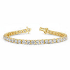 My Store 4 custom 4-prong yellow gold tennis bracelet featuring round brilliant cut diamonds with a secure box clasp.