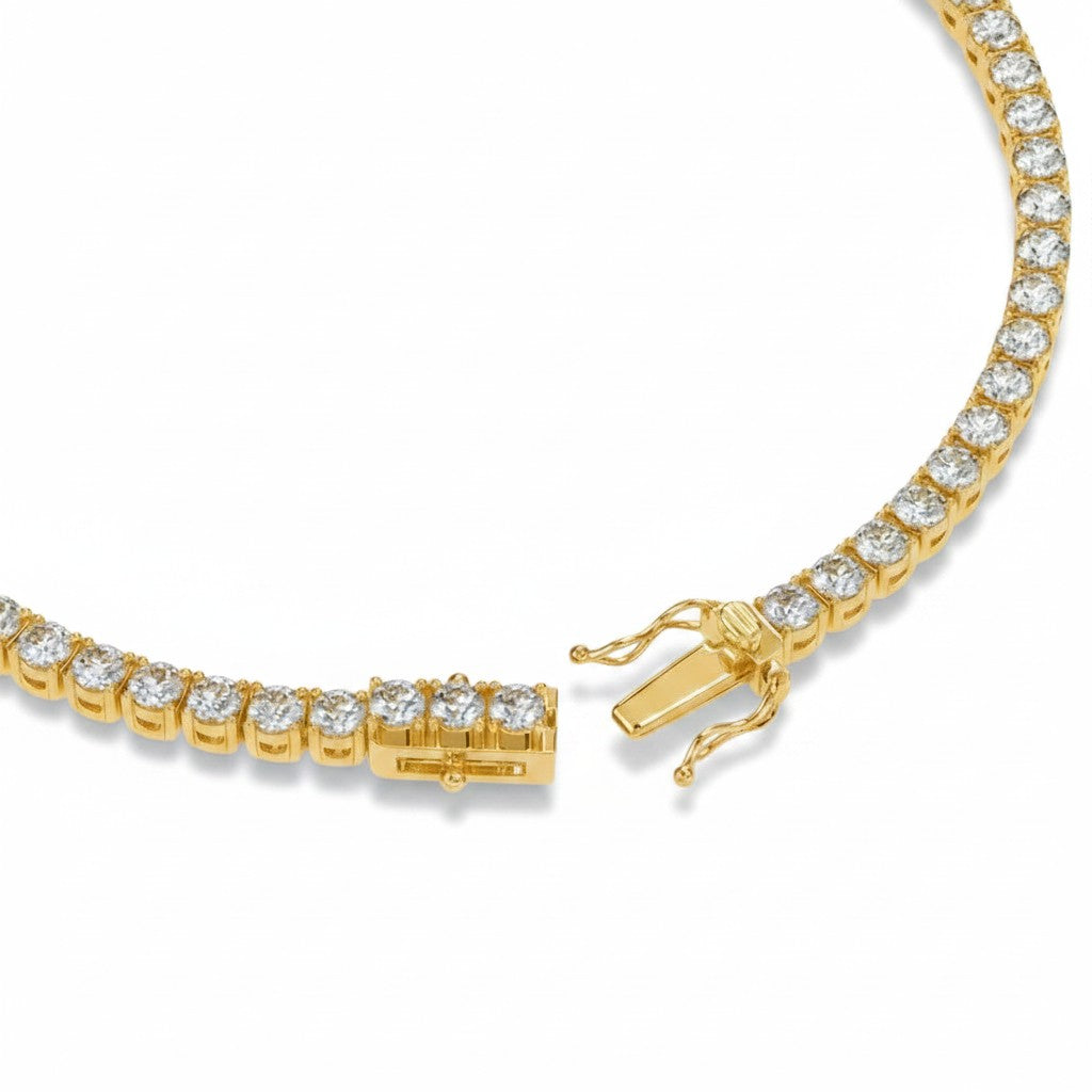 My Store 4 yellow gold tennis bracelet featuring a row of round brilliant white diamonds and a secure box clasp