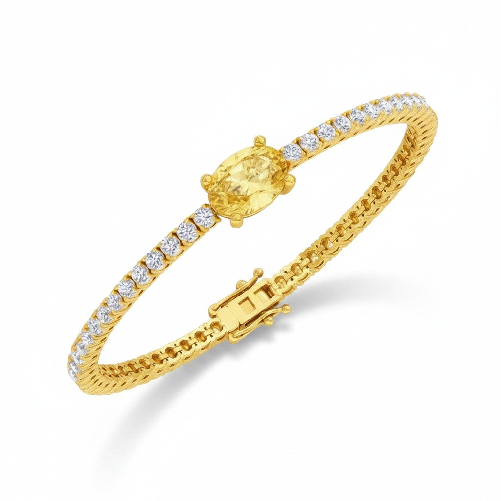 My Store 4 yellow gold tennis bracelet featuring a central oval-cut fancy yellow diamond and round white diamonds.