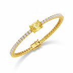 My Store 4 yellow gold tennis bracelet featuring a central oval-cut fancy yellow diamond and round white diamonds.