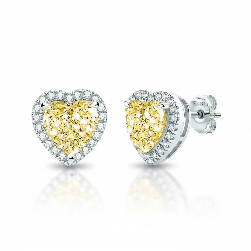 My Store 4 heart-cut fancy yellow diamond stud earrings with a white diamond halo set in polished white gold.