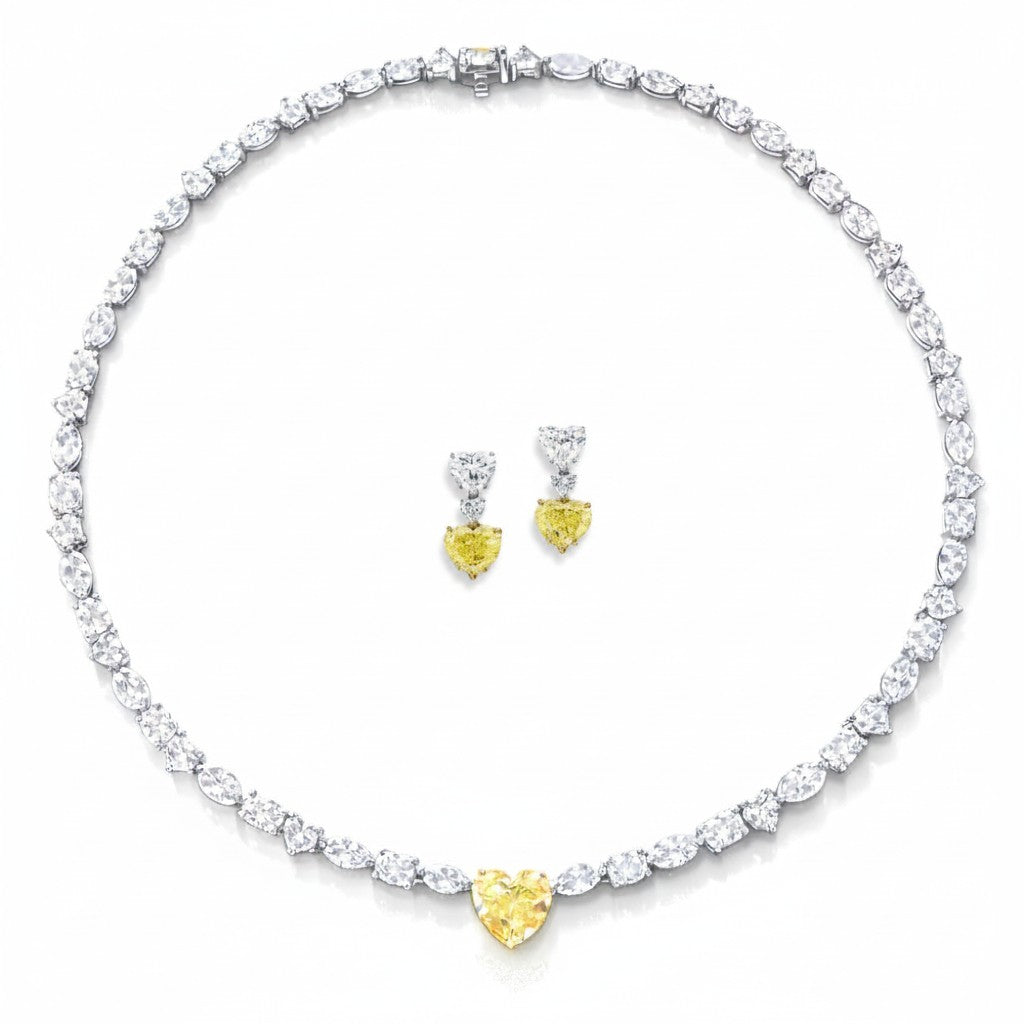 My Store 4 mixed cut white diamond tennis necklace with a central yellow heart diamond and matching drop earrings.