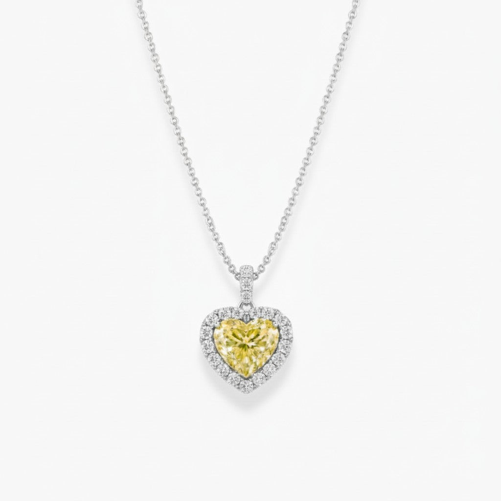 My Store 4 fancy yellow heart-cut diamond pendant necklace with a white diamond halo on a gold cable chain.