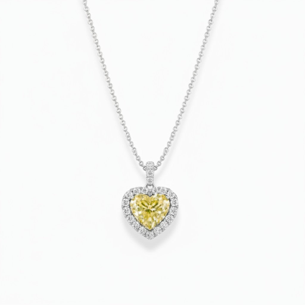 My Store 4 heart-cut fancy yellow diamond pendant necklace with a white diamond halo on a delicate gold cable chain.