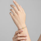 My Store 4 tennis bracelet featuring a central fancy yellow heart-cut diamond surrounded by round white diamonds.