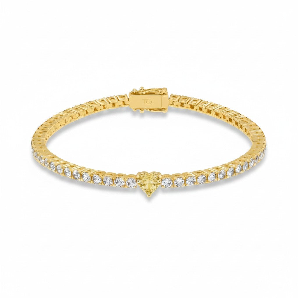 My Store 4 yellow gold tennis bracelet featuring a central heart-cut yellow diamond and round white diamond links.