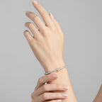 My Store 4 tennis bracelet featuring a central fancy yellow heart-cut diamond surrounded by round white diamonds.