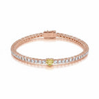 My Store 4 tennis bracelet in rose gold featuring a central fancy yellow heart-cut diamond and round white diamonds.
