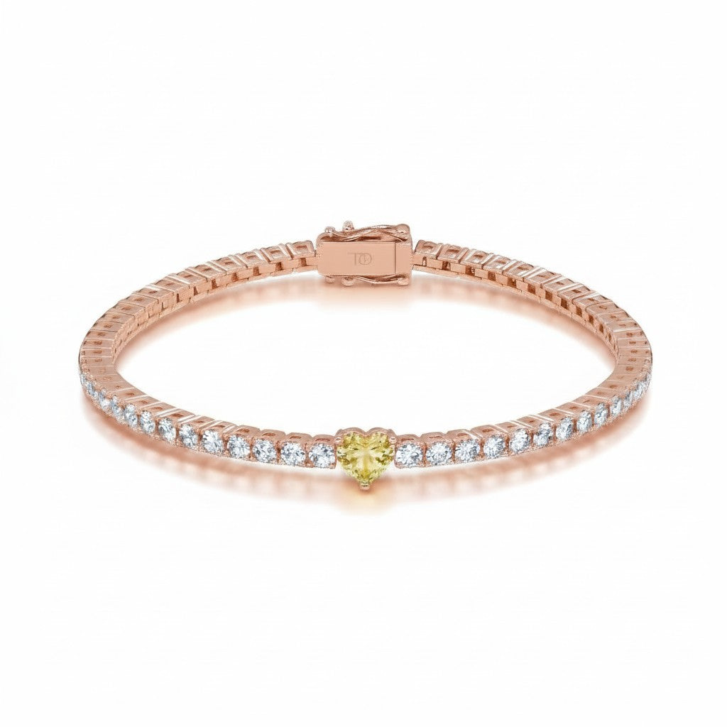 My Store 4 tennis bracelet in rose gold featuring a central fancy yellow heart-cut diamond and round white diamonds.