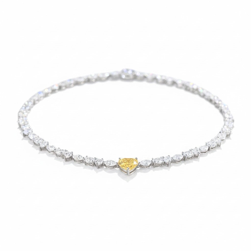 My Store 4 tennis necklace featuring a central yellow heart-cut diamond surrounded by mixed-cut white diamonds
