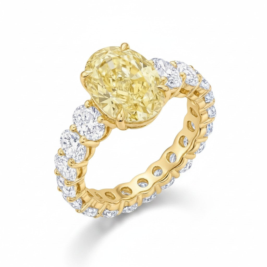 My Store 4 18K solid gold engagement ring featuring a fancy yellow oval lab-grown diamond and diamond-encrusted band.