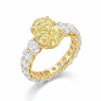 My Store 4 18K solid gold engagement ring featuring a fancy yellow oval lab-grown diamond and diamond-encrusted band.