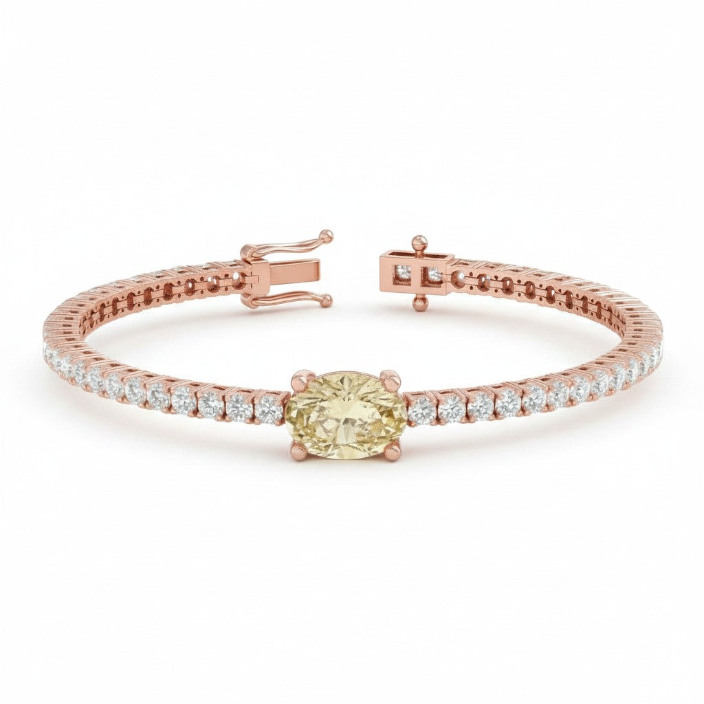 My Store 4 tennis bracelet featuring a central oval-cut fancy yellow diamond flanked by round white diamonds in gold.