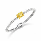 My Store 4 tennis bracelet featuring a central fancy yellow oval diamond in a gold setting with white diamond links.