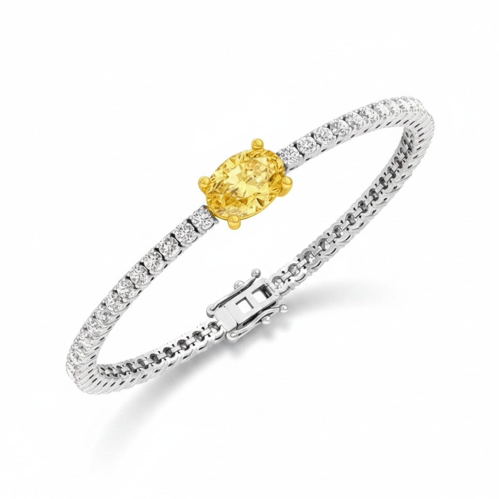 My Store 4 tennis bracelet featuring a central fancy yellow oval diamond in a gold setting with white diamond links.