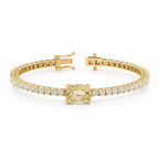 My Store 4 yellow gold tennis bracelet featuring a central oval-cut fancy yellow diamond and round white diamonds.
