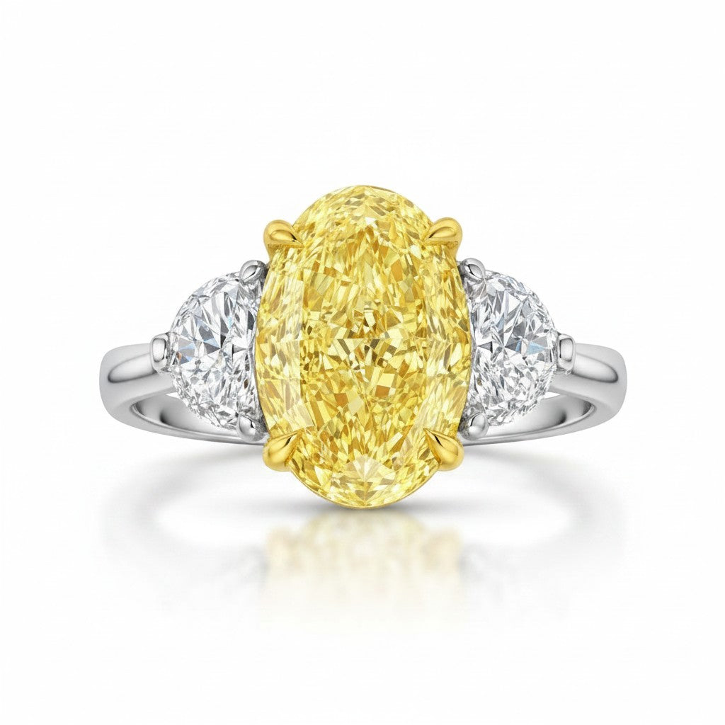 My Store 4 18K gold trilogy ring featuring a fancy yellow oval lab-grown diamond flanked by two side diamonds.
