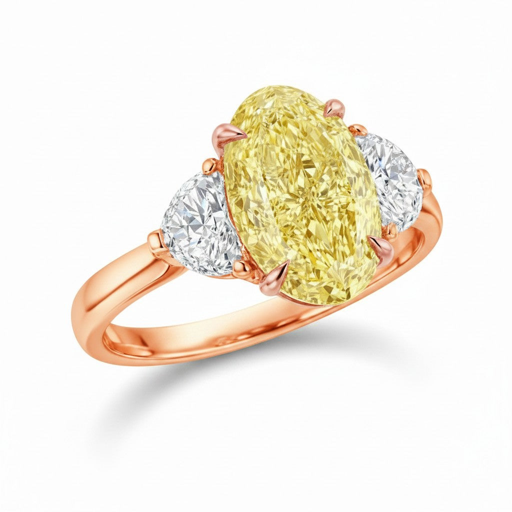 My Store 4 18K solid gold trilogy ring featuring a fancy yellow oval lab-grown diamond flanked by two side diamonds.