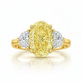 My Store 4 18K solid gold trilogy ring featuring a fancy yellow oval lab-grown diamond flanked by two side diamonds.